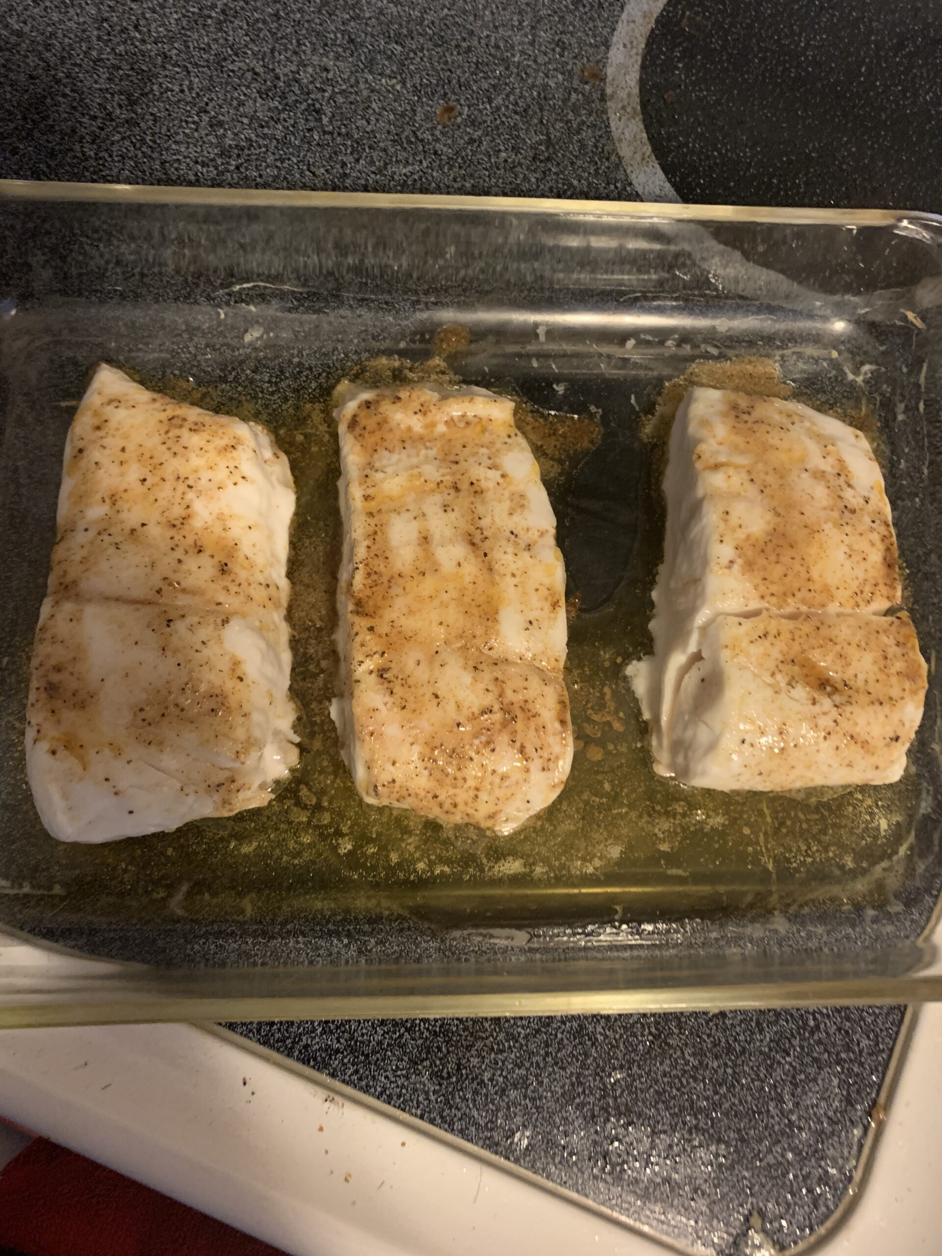 Pan of baked halibut.