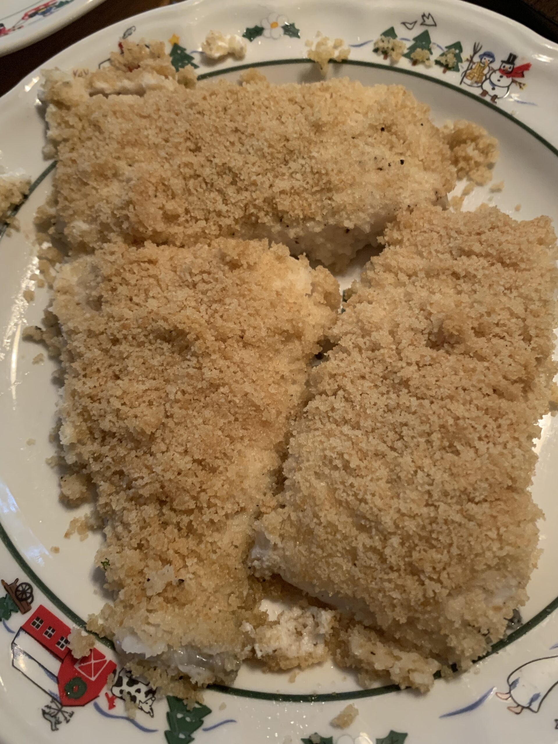 Baked Haddock with breadcrumb topping on a plate.