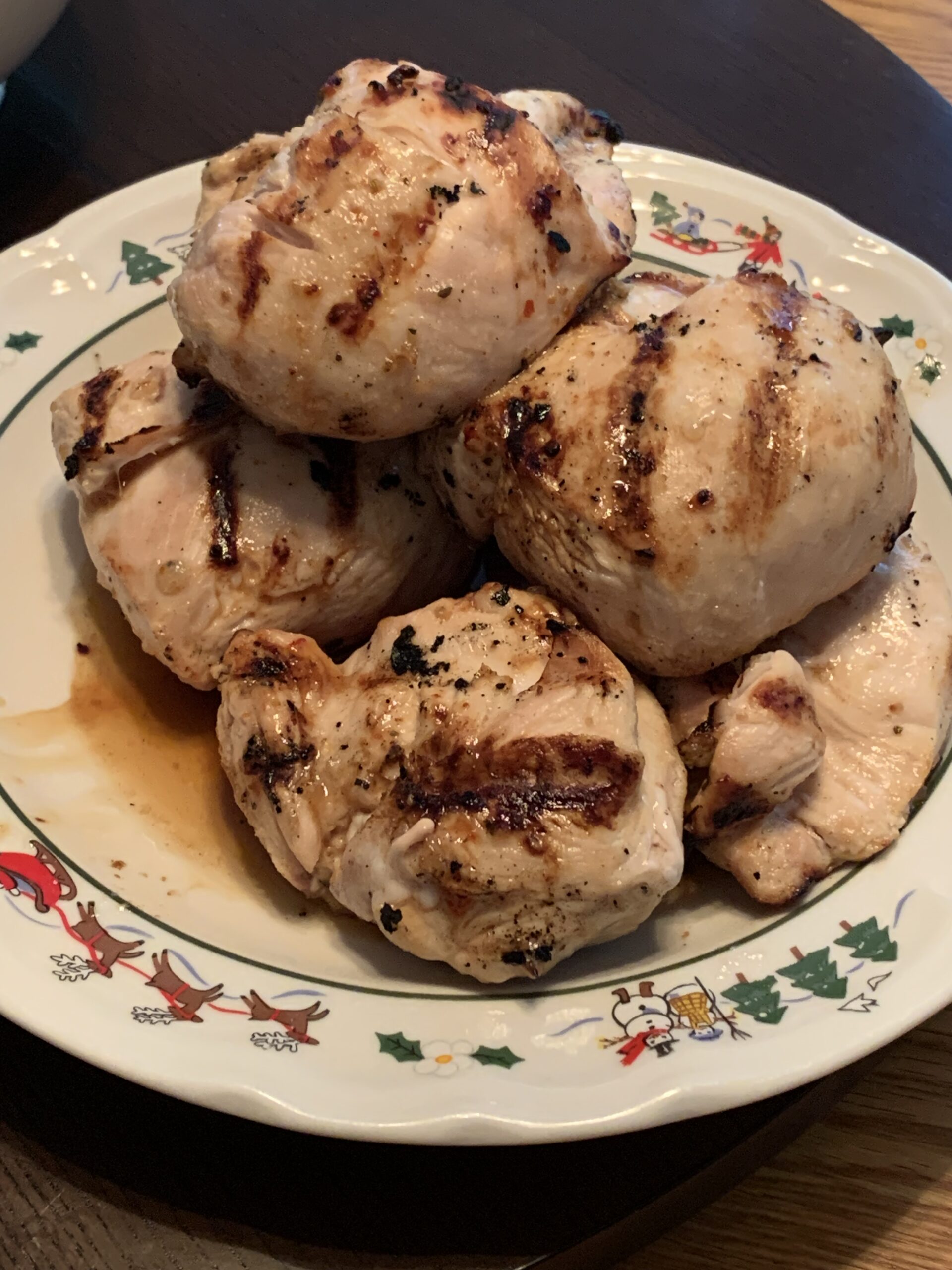 Pieces of grilled chicken breast that have been marinaded in Italian dressing.